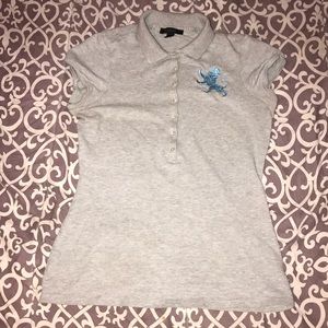 Grey polo shirt with dragon logo.